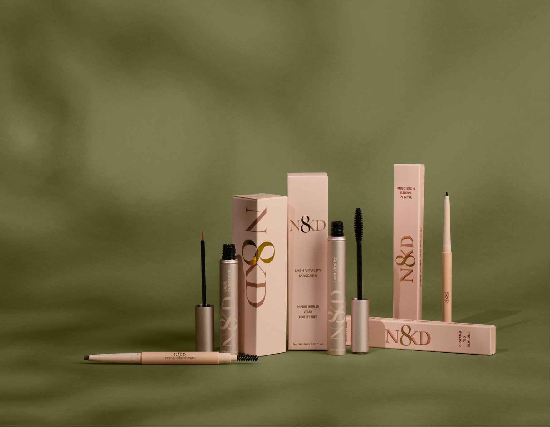 N8KD eye makeup collection featuring N8KD Lash Vitality Mascara, N8KD Lash Enhancing Serum, N8KD Infinite Gel Eyeliner, and N8KD Precision Brow Pencil